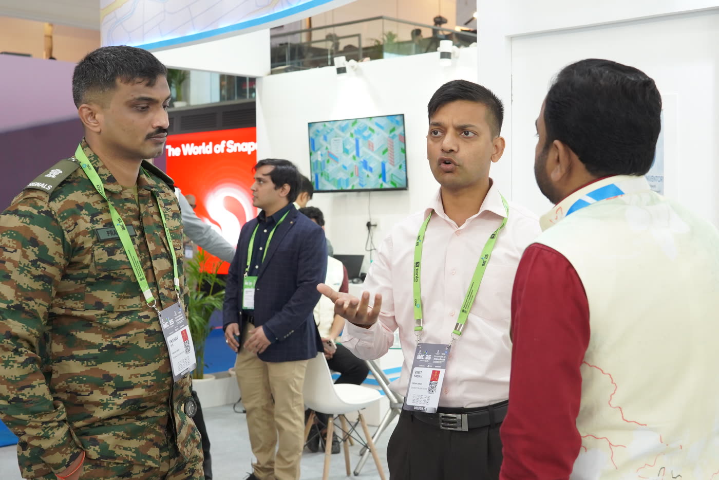 Indian Army officer in conversation with Lepton representatives at the IMC 2025 booth
